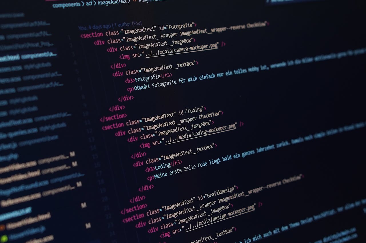 Mastering the First Impression: Your intriguing post title goes here Close-up view of HTML code displayed on a dark screen, showcasing coding concepts.